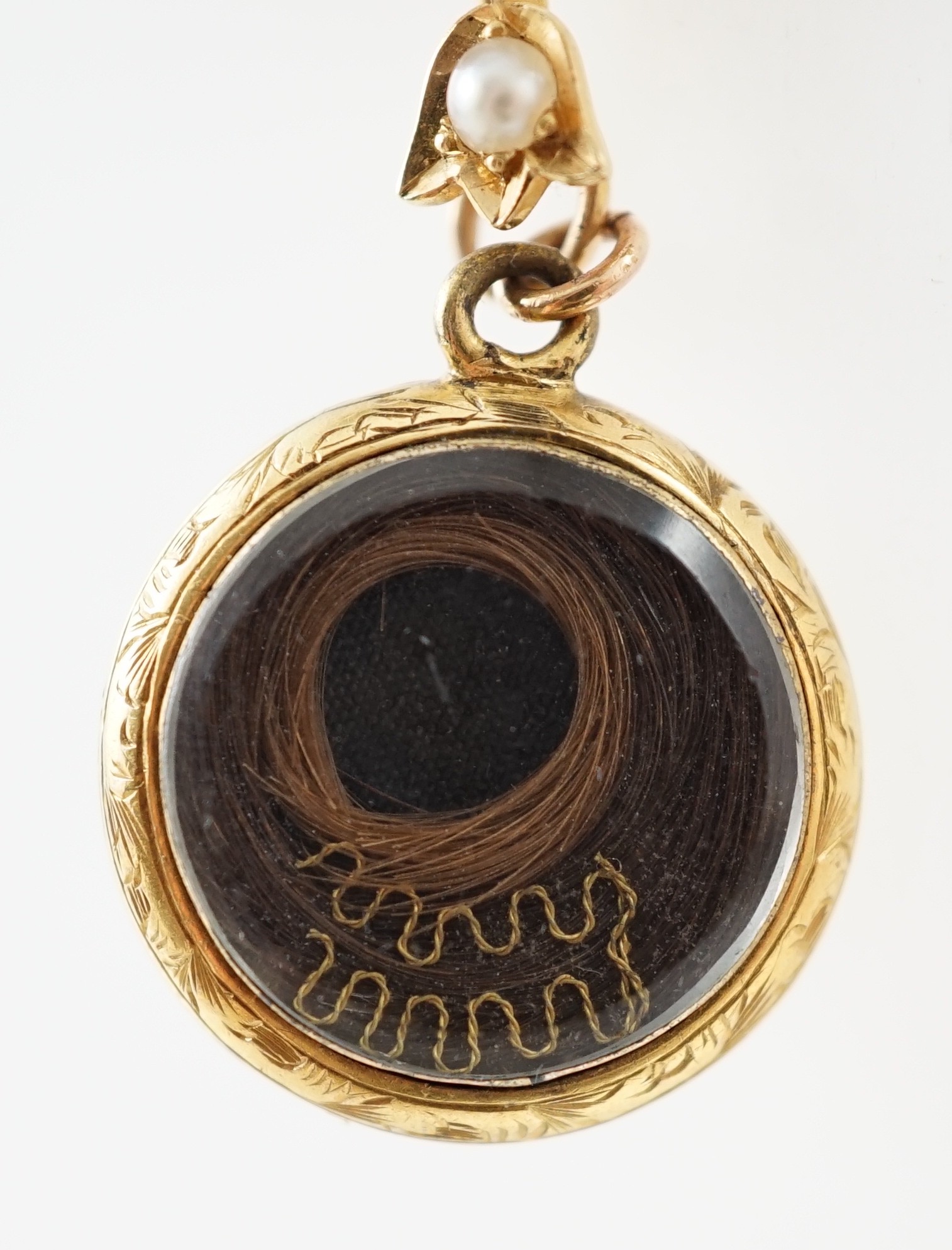 A Victorian gold, black enamel and seed pearl set mourning pendant necklace